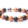 7" Orange and Black 10mm Freshwater Cultured Pearl Bracelet. Handmade with 10mm crimson and white pearls. Hand strung, double knotted and finished with a silver clasp. Spirit Pearl also offers a matching necklace and earrings. Great gift for any Oklahoma State University fans. GO COWBOYS!